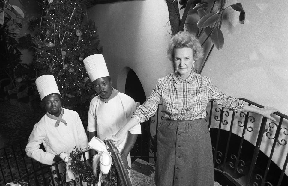 Nina Johansen, owner and chef of Le Chateau restaurant, is pictured with saucier Charles Freeman, at left, and assistant chef Morgan White on the staircase in this 1982 file photo.