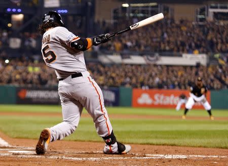 Oct 1, 2014; Pittsburgh, PA, USA; San Francisco Giants shortstop Brandon Crawford (35) hits a grand slam home run against the Pittsburgh Pirates during the fourth inning of the 2014 National League Wild Card playoff baseball game at PNC Park. Charles LeClaire-USA TODAY Sports