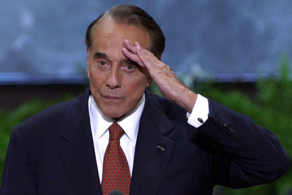 FILE - In this Aug. 1, 2000, file photo, former senator and former presidential candidate Bob Dole salutes after a speech at the Republican National Convention in the First Union Center in Philadelphia. Dole died Sunday, Dec. 5, 2021, at the age of 98. (AP Photo/Ron Edmonds, File)