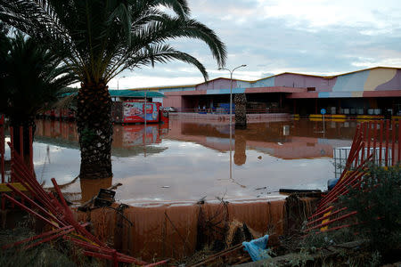 The yard of a factory, is seen under flood waters following flash floods which hit the town of Magoula, Greece, June 27, 2018. REUTERS/Costas Baltas