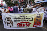 Activists of Socialist Unity Center of India-Marxist (SUCI-M) protesting against gang rape and killing of a woman in India's northern state of Uttar Pradesh shout slogans in Kolkata, India, Thursday, Oct. 1, 2020. The gang rape and killing of the woman from the lowest rung of India's caste system has sparked outrage across the country with several politicians and activists demanding justice and protesters rallying on the streets. Banner reads, Protesting the brutal rape and murder of a Dalit girl in Uttar Pradesh. Modi government should answer why rape and oppression constantly increasing in the country. (AP Photo/Bikas Das)