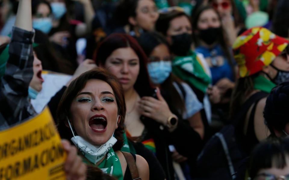 Chilean women celebrate after the Chilean Chamber of Deputies passed abortion bill on September 28, 2021 in Santiago - Marcelo Hernandez/Getty Images