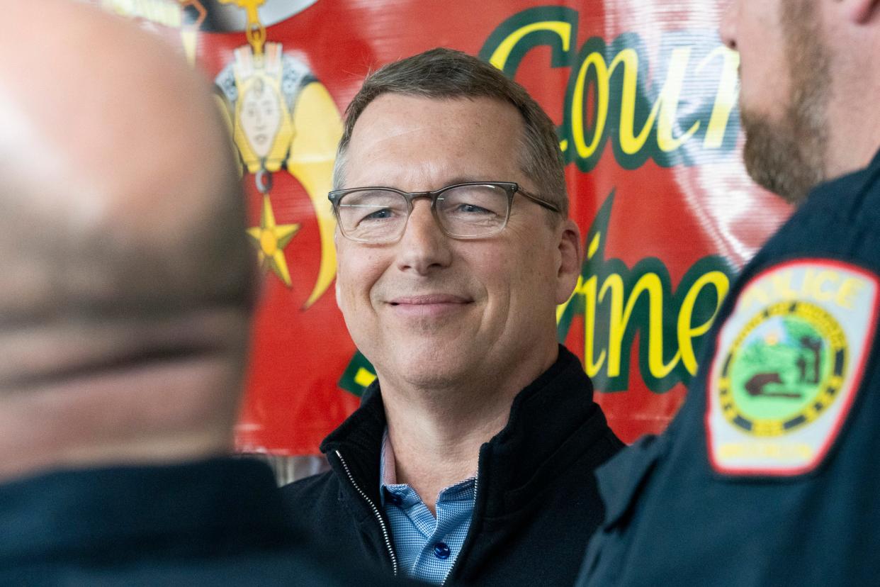 Eric Doden, an Indiana Republican gubernatorial candidate, talks with police officers, Wednesday, April 3, 2024, during a Morgan County Fraternal Order of Police Lodge 119 meeting at the Martin County Shrine Club in Martinsville, Indiana.