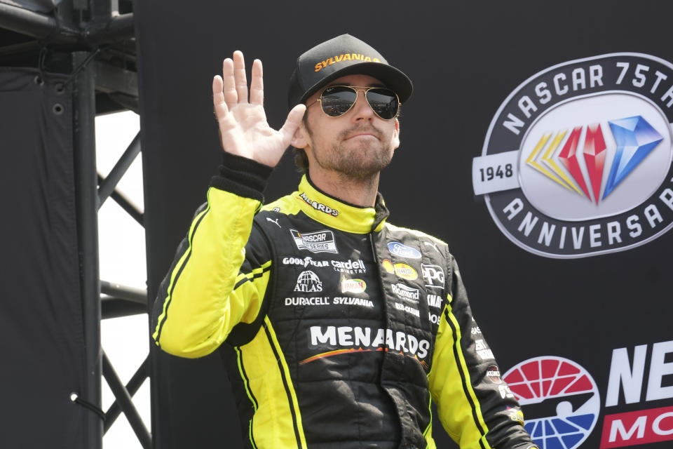 FILE -NASCAR Cup Series driver Ryan Blaney is introduced before the Crayon 301 NASCAR Cup Series race, Monday, July 17, 2023, at New Hampshire Motor Speedway, in Loudon, N.H. Roger Penske achieved something this season the pioneering motorports magnate had never done in his long, accomplished career with back-to-back NASCAR championships. (AP Photo/Steven Senne, File)