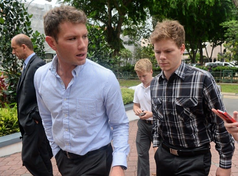 The brothers of US scientist Shane Todd, John (front L), Dylan (R), Chet (C-background) and Ashraf Massoud (L), a private forensic investigator hired by Todd family, arrive at the Subordinate courts in Singapore, on May 22, 2013. Two US pathologists supported Singapore police findings that an American scientist found hanged last year in the city-state committed suicide and was not murdered