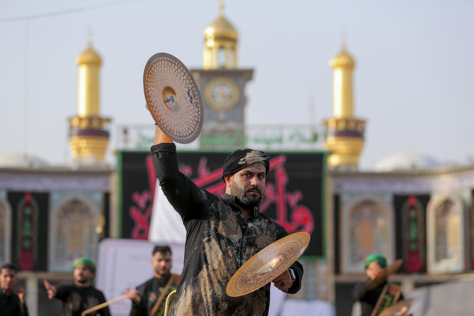 Iraqi Shiites take part in Ashura that marks the martyrdom of Husayn ibn Ali, a grandson of the Islamic prophet Muhammad, and members of his immediate family in the Battle of Karbala, in Karbala, Iraq, Monday, Aug. 8, 2022. (AP Photo/Anmar Khalil)