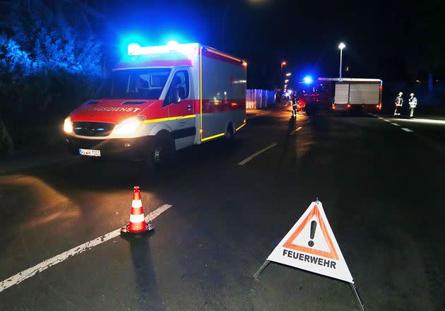 Rescuers gather on a road near railtracks in Wuerzburg, southern Germany, after a man attacked train passengers with an axe (Photo: KARL-JOSEF HILDENBRAND via Getty Images)