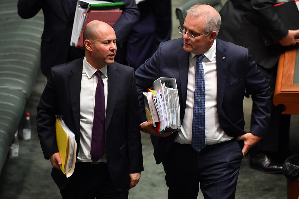 CANBERRA, AUSTRALIA - MAY 13: Treasurer Josh Frydenberg and Prime Minister Scott Morrison during Question Time in the House of Representatives at Parliament House on May 13, 2021 in Canberra, Australia. Labor leader Anthony Albanese will tonight respond to the Morrison government's third budget, handed down on Tuesday, which has an increased focus on women, with almost $354 million in funding allocated for women's health. Treasurer Josh Frydenberg also outlined more than $10 billion in spending on major infrastructure projects across Australia aimed to help create local jobs and boost productivity in the COVID-affected national economy. Aged care will receive more than $10 billion over the next four years, in direct response to the findings of the Royal Commission into Aged Care Quality and Safety. (Photo by Sam Mooy/Getty Images)