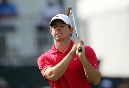 Aug 21, 2014; Paramus, NJ, USA; Rory McIlroy reacts to a putt on the 17th green during the first round of The Barclays golf tournament at Ridgewood Country Club. John Munson/THE STAR-LEDGER via USA TODAY Sports