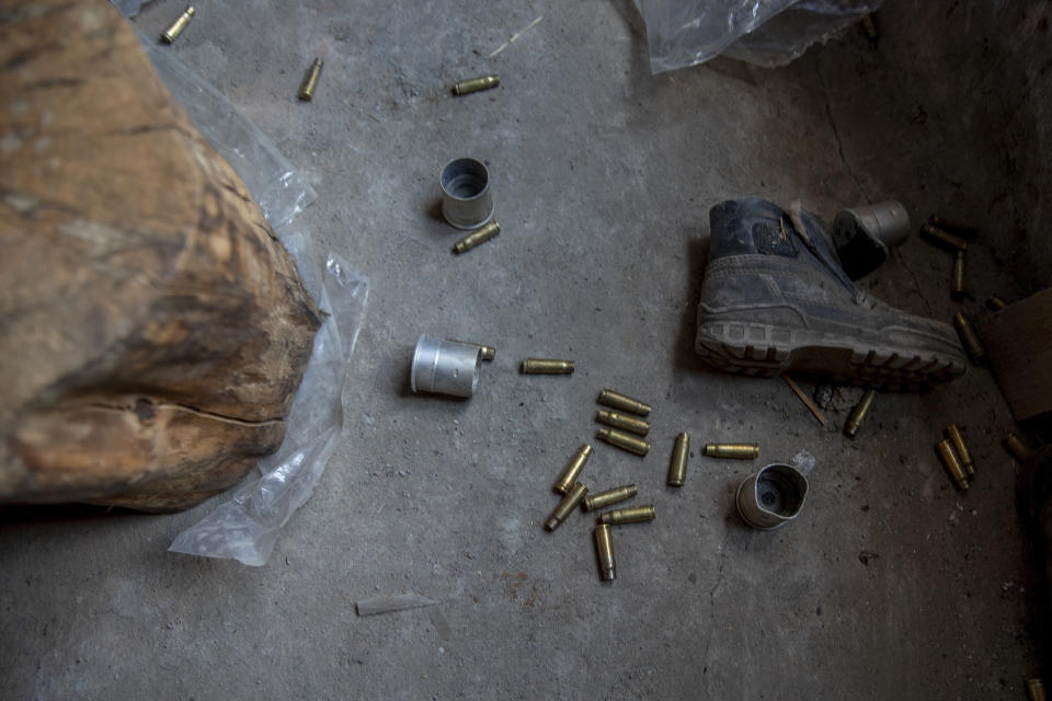 Empty bullet cartridges lie inside the house near the site of a gunbattle between Indian soldiers and suspected militants in Shopian, south of Srinagar, Indian controlled Kashmir, Friday, April 9, 2021. Seven suspected militants were killed and four soldiers wounded in two separate gunfights in Indian-controlled Kashmir, officials said Friday, triggering anti-India protests and clashes in the disputed region. (AP Photo/ Dar Yasin)