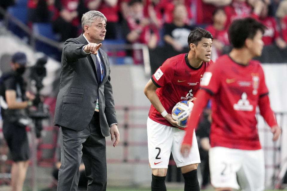 Head coach Maciej Skorza of Japan's Urawa Red Diamonds, left, directs during the AFC Champions League final match between Japan's Urawa Red Diamonds and Saudi Arabia's Al Hilal at Saitama Stadium in Saitama, near Tokyo, Saturday, May 6, 2023. (AP Photo/Toru Hanai)