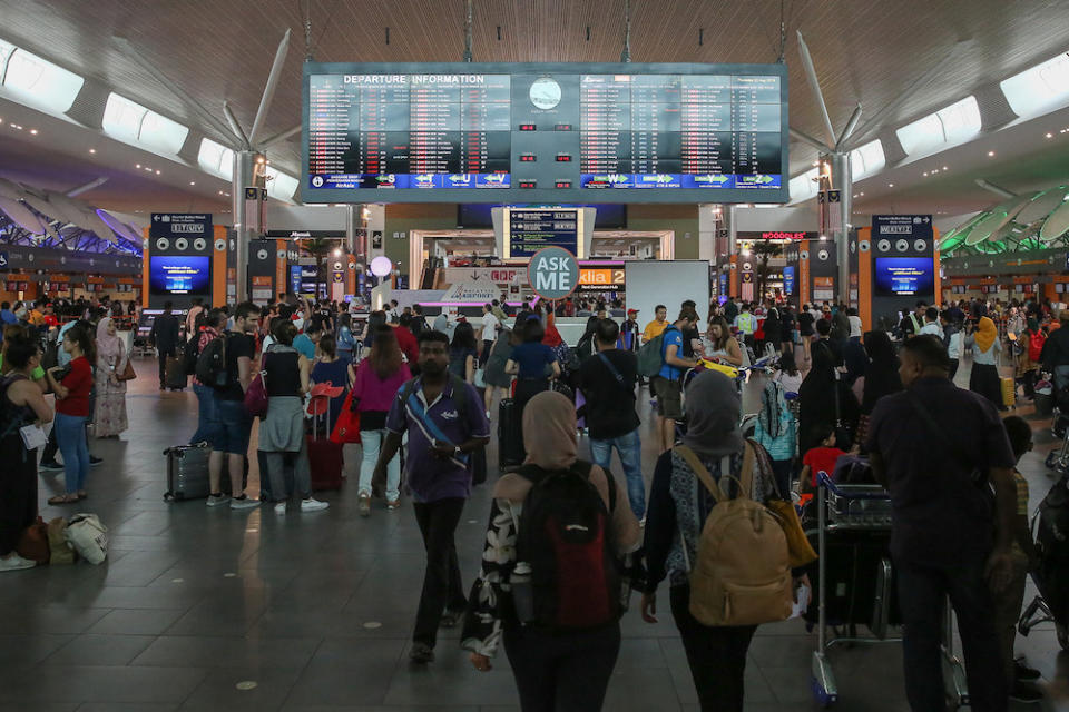 Passengers are seen at KLIA2 in Sepang August 22, 2019, during a systems outage. — Picture by Yusof Mat Isa