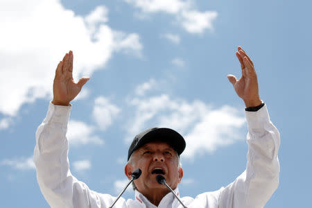 FILE PHOTO: Leftist front-runner Andres Manuel Lopez Obrador of the National Regeneration Movement (MORENA) gestures to supporters during his campaign rally in Mexico City, Mexico June 3, 2018. REUTERS/Carlos Jasso