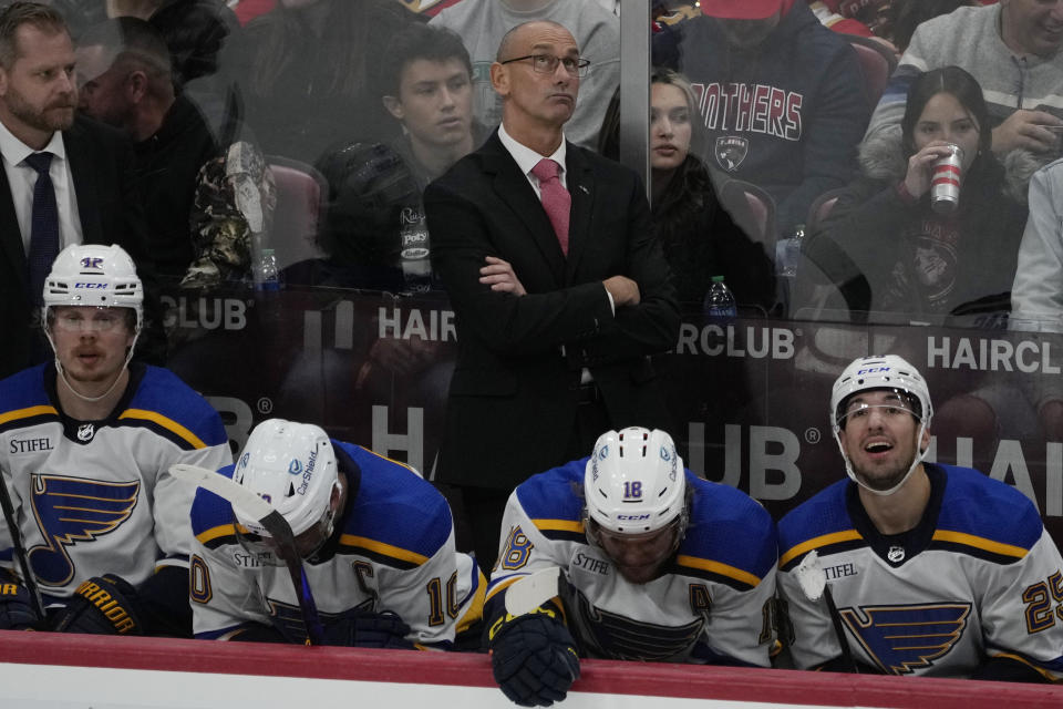 St. Louis Blues interim head coach Drew Bannister looks up during the second period of an NHL hockey game against the Florida Panthers, Thursday, Dec. 21, 2023, in Sunrise, Fla. (AP Photo/Marta Lavandier)