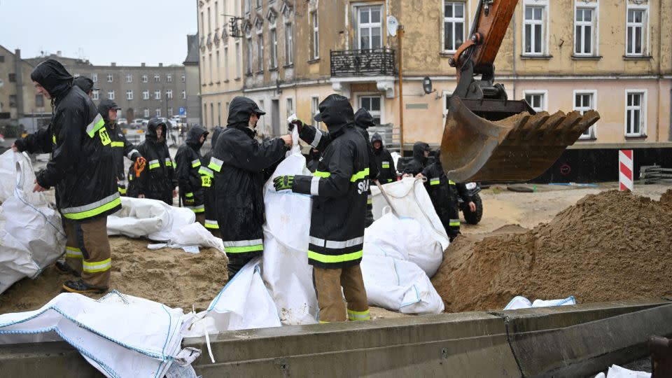 Firefighters fill sand bags in Glucholazy, southern Poland. - Sergei Gapon/AFP/Getty Images