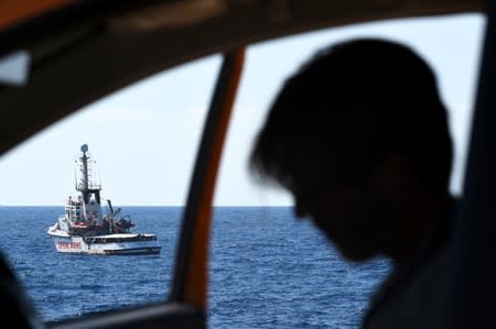 Spanish migrant rescue ship Open Arms is seen close to the Italian shore in Lampedusa