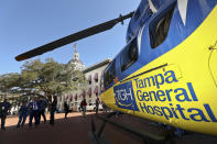 Visitors check out Tampa General Hospital's helicopter during "We Are TGH Day" Wednesday, Feb. 8, 2023 at the Capitol in Tallahassee, Fla. (AP Photo/Phil Sears)
