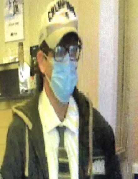 The suspect in an armed robbery at Northeast Credit Union in Lee is seen in this surveillance image from the bank, according to police.