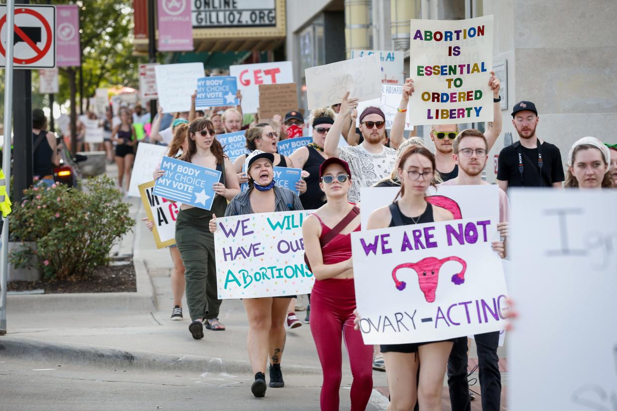 Hundreds of community members march along East Saint Louis Street from Park Central Square to the federal courthouse during an abortion-rights protest Monday, July 4, 2022.