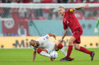 Tunisia's Hannibal Mejbri, left, and Denmark's Simon Kjaer vie for the ball during the World Cup group D soccer match between Denmark and Tunisia, at the Education City Stadium in Al Rayyan , Qatar, Tuesday, Nov. 22, 2022. (AP Photo/Petr David Josek)