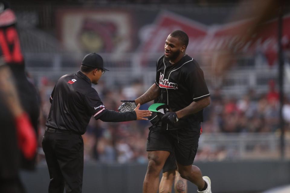 Micah Parsons celebrates hitting a home run during the second annual A&A All the Way charity softball game held at Southwest University Park in El Paso on June 29, 2023. 