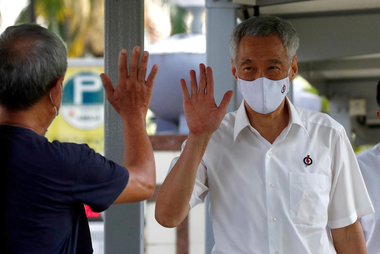 Singapore's Prime Minister Lee Hsien Loong of the ruling People's Action Party arrives at a nomination center ahead of the general election in Singapore June 30, 2020. REUTERS/Edgar Su     TPX IMAGES OF THE DAY