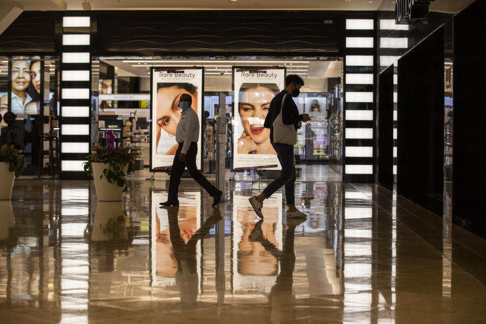 COSTA MESA, CA - SEPTEMBER 28:  Amid Gov. Gavin Newsoms current red-tier restrictions, shoppers are allowed to reach at a maximum of 25% capacity while shopping at South Coast Plaza on Monday, Sept. 28, 2020 in Costa Mesa, CA. OC may be moving up to the Orange tier as early as Tuesday. Moving up to the orange tier means retail businesses could operate at full capacity, instead of 50% in the current red tier. Shopping malls also could operate at full capacity, but with closed common areas and reduced food courts just as in the red tier. The orange tier boosts capacity for churches, restaurants, movies, museums, zoos and aquariums from 25% capacity to half capacity. Gyms and fitness centers could boost capacity from 10% to 25% and reopen pools. Most boutiques and all department stores are open for shopping. South Coast Plaza is billed as the largest shopping center on the West Coast with 250 boutiques, 30 restaurants and sales of over $1.5 billion annually, the highest in the U.S. (Allen J. Schaben / Los Angeles Times via Getty Images)