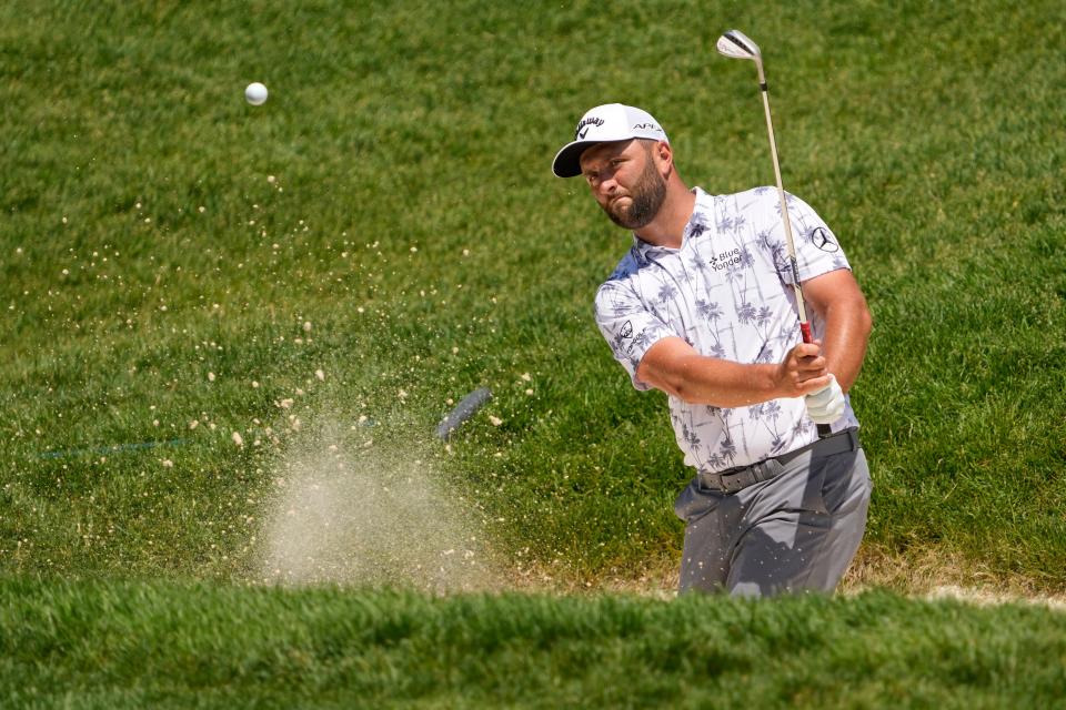 May 31, 2022; Dublin, Ohio, USA; Jon Rahm hits out of a bunker on the 8th hole during a practice round of the Memorial Tournament at Muirfield Village Golf Club in Dublin, Ohio on May 31, 2022. 