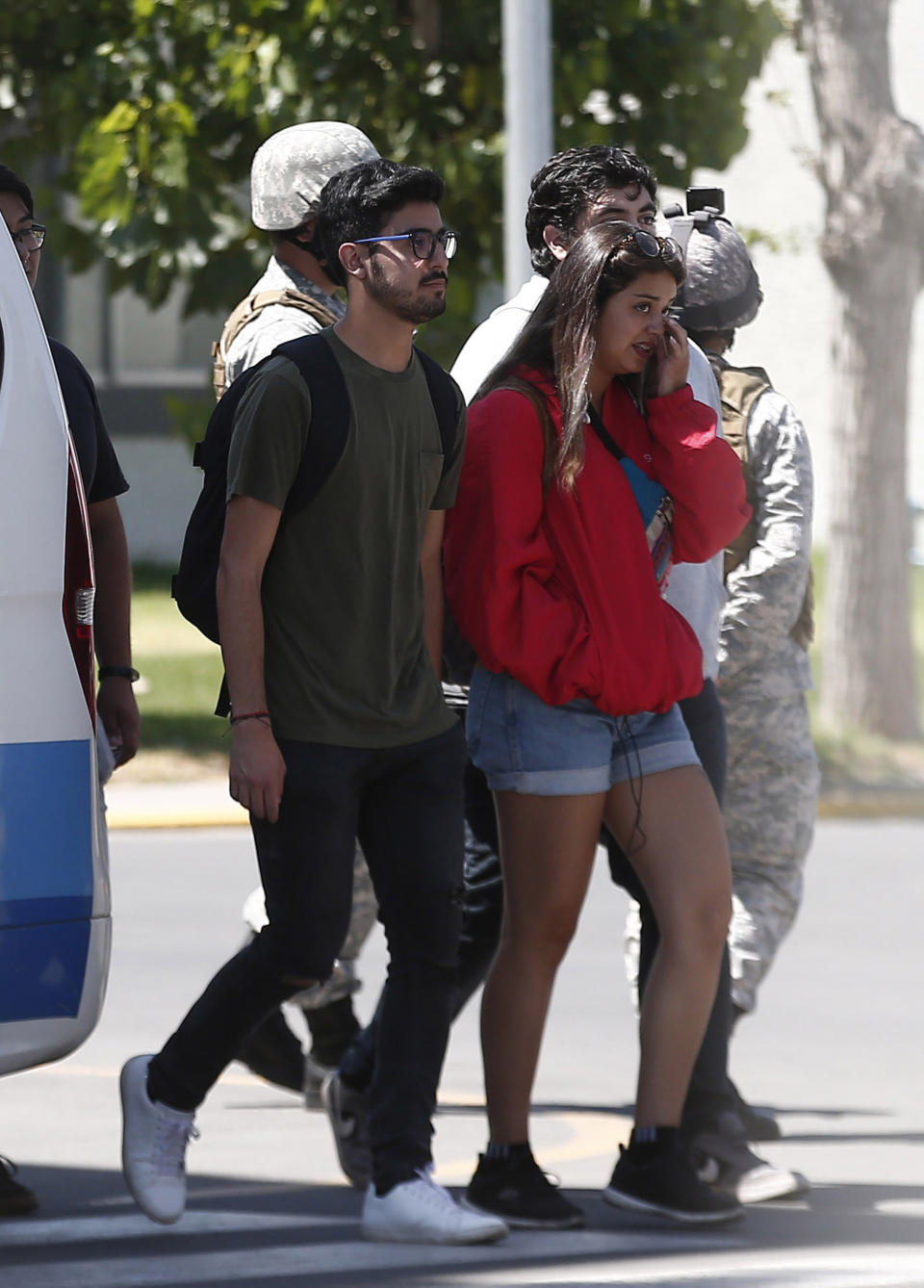 Relatives of passengers of a missing military plane arrive at the Cerrillos airbase in Santiago, Chile, Tuesday, Dec. 10, 2019. Chile's air force said it lost radio contact with a C-130 Hercules transport plane carrying 38 people on a flight to the country's base in Antarctica, and authorities are indicating they are not optimistic about the aircraft's fate. (AP Photo/Luis Hidalgo)