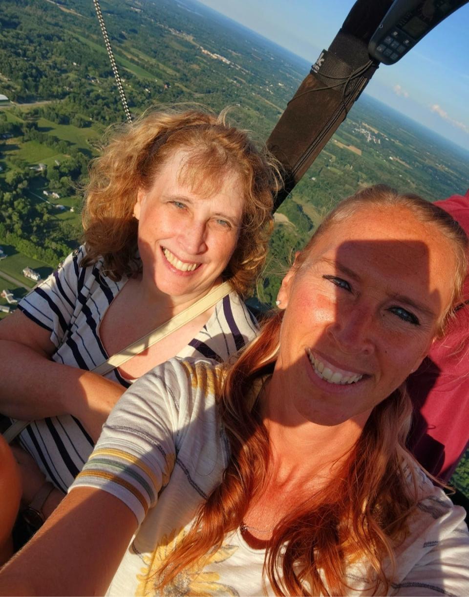 Belinda Holderfield, left, and her niece Rachel Workinger-Perry pose for a selfie Friday during a hot air balloon flight over Portage County.