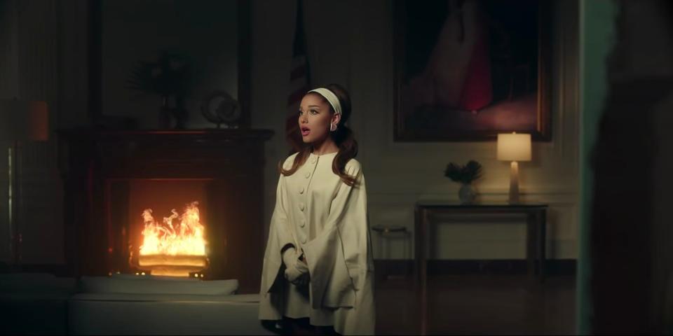 ariana grande positions white coat