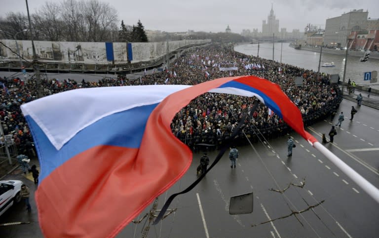 Russian opposition supporters of Kremlin critic Boris Nemtsov march in central Moscow last year shortly after his killing