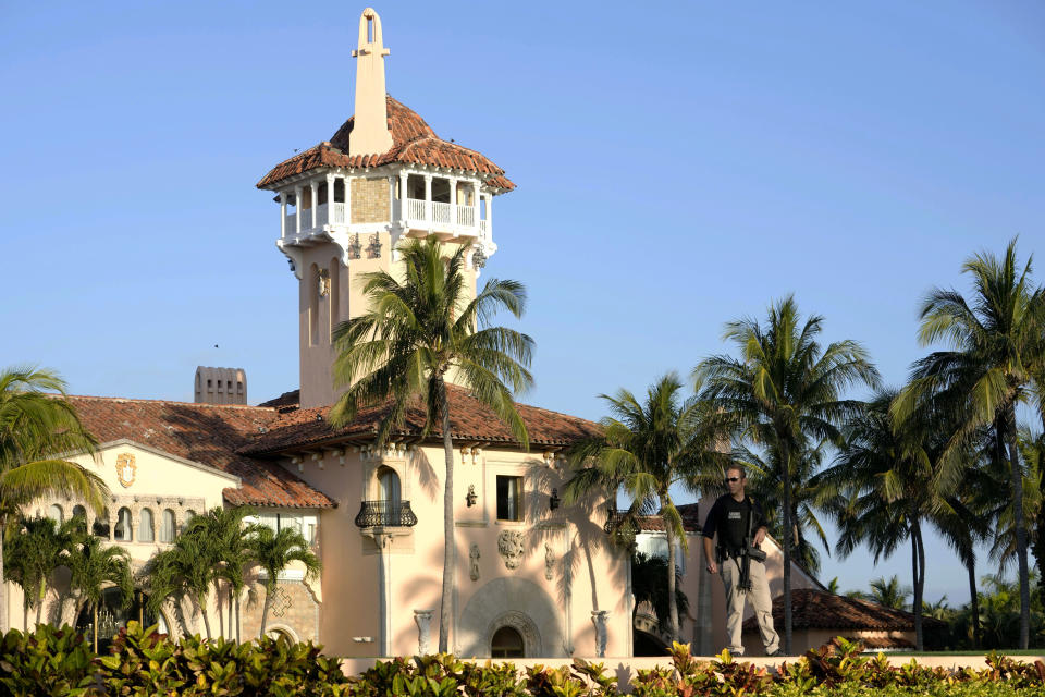 A Secret Service officer stands in front of former President Donald Trump's Mar-a-Lago estate, Tuesday, March 21, 2023, in Palm Beach, Fla. (AP Photo/Lynne Sladky)