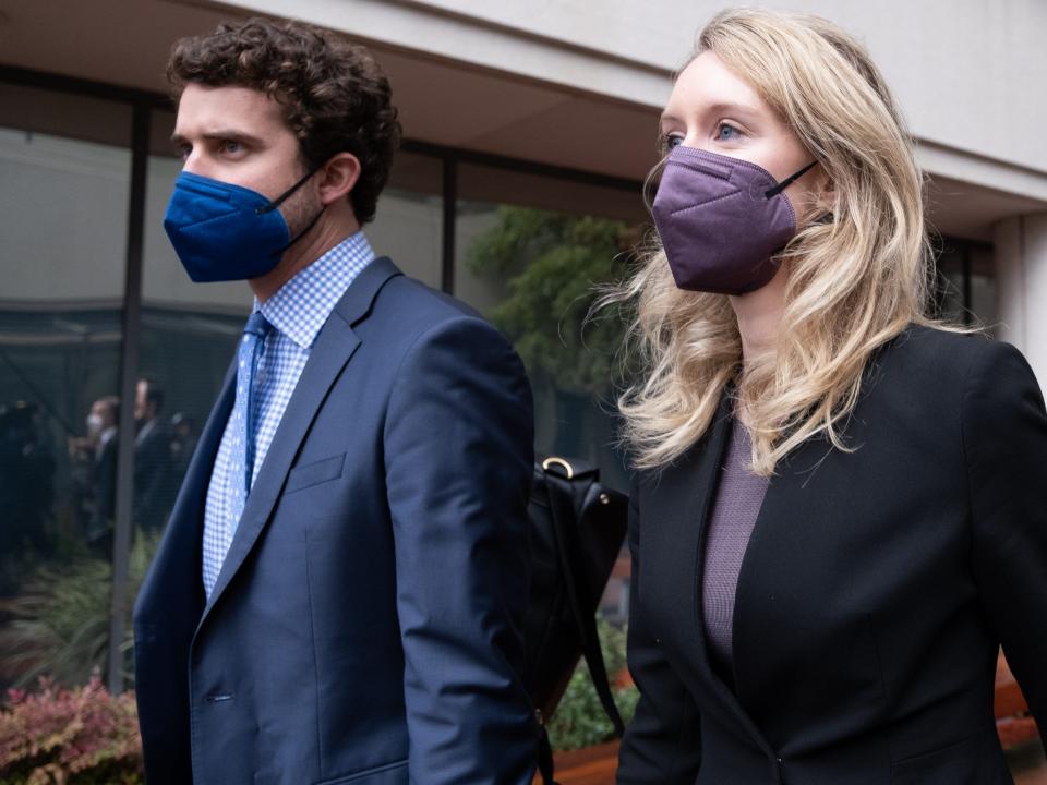 SAN JOSE, CA - DECEMBER 23: Billy Evans walks with his partner Theranos founder and former CEO Elizabeth Holmes and her mother Noel Holmes as they leave the Robert F. Peckham Federal Building on December 23, 2021 in San Jose, California. Jury deliberations continue in the Elizabeth Holmes fraud trial as she faces charges of conspiracy and wire fraud for allegedly engaging in a multimillion-dollar scheme to defraud investors with the Theranos blood-testing lab services.