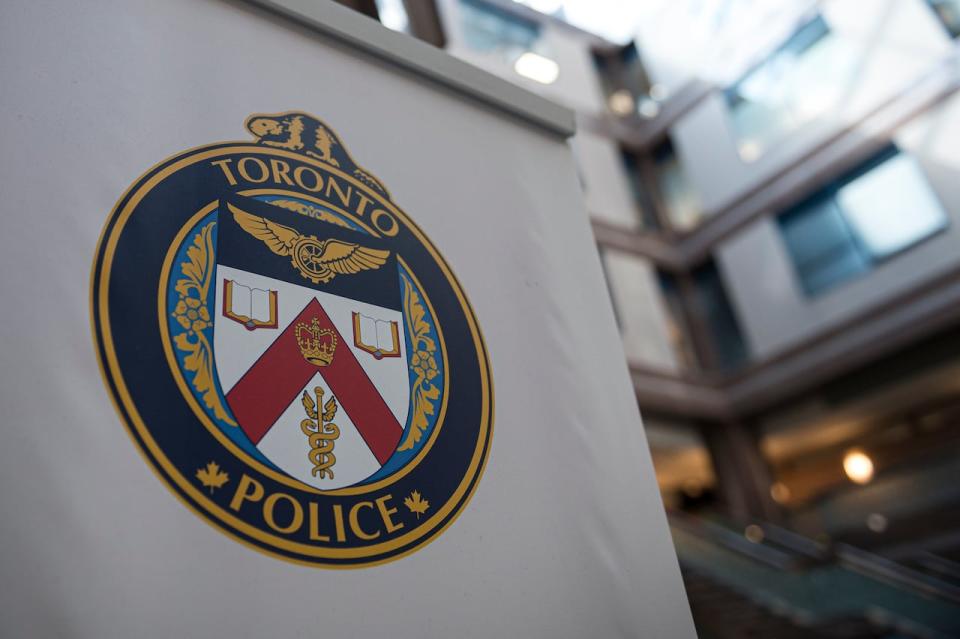 The 51-year-old Toronto police officer, arrested Thursday on charges including careless firearm storage, has been with the service for 21 years, according to a Toronto police press release.  (Christopher Katsarov/The Canadian Press - image credit)