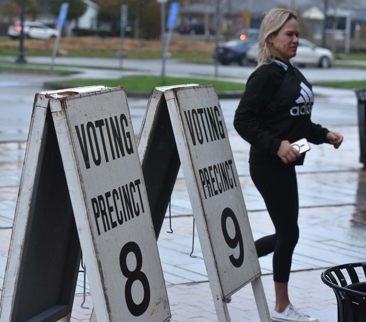 Dodging the raindrops right after the polls opened at the Hyannis Youth and Community Center on Election Day for the Town of Barnstable for voters in precincts 8,9, and 13.