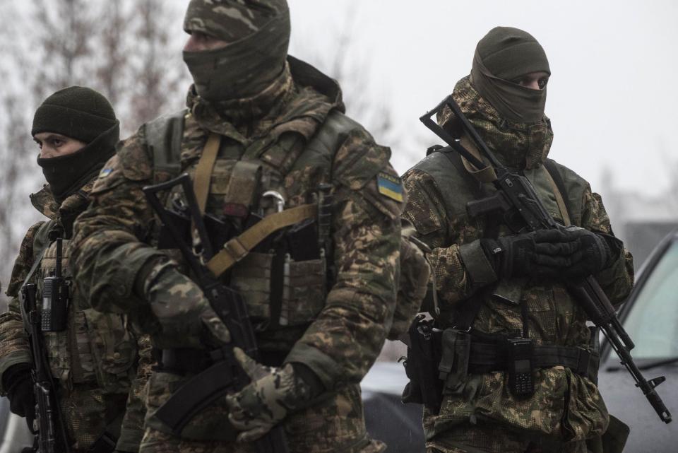 Ukrainian servicemen patrol at the humanitarian aid center in Avdiivka, Ukraine, Saturday, Feb. 4, 2017. Fighting in eastern Ukraine sharply escalated this week. Ukraine's military said several soldiers were killed over the past day in shelling in eastern Ukraine, where fighting has escalated over the past week. (AP Photo/Evgeniy Maloletka)