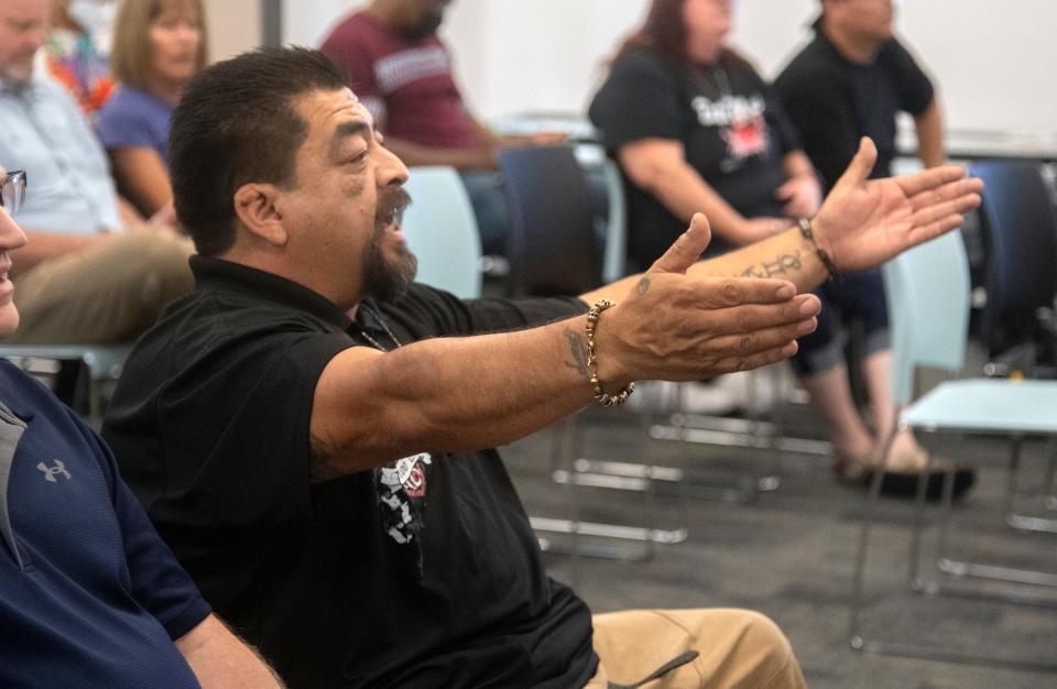 Area resident Rafael Cardoza comments from his seat at a town hall meeting about the critical grand jury report at the SUSD headquarters in downtown Stockton.