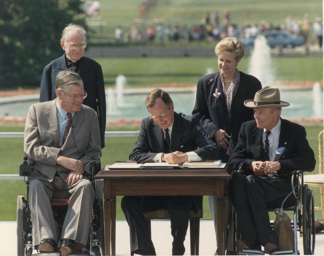 In this file photo from 1990, George H.W. Bush signs the Americans With Disabilities Act. The former president died last week at age 94. (Photo: Fotosearch via Getty Images)