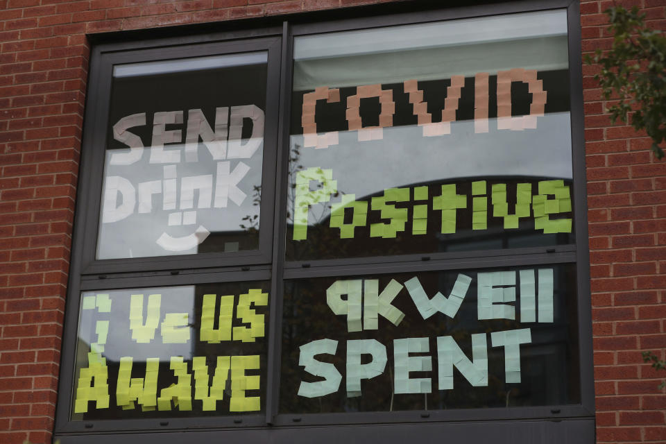 Students posted signs on their windows at Manchester Metropolitan University's Birley campus. (AP)