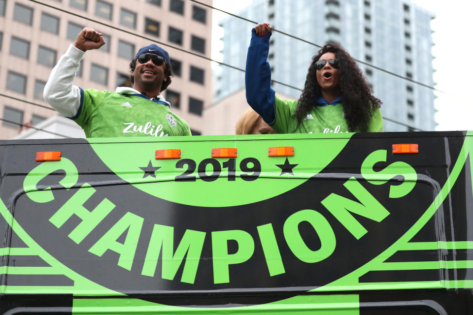 Seattle Seahawks quarterback Russell Wilson, left, and wife Ciara announced they're expecting a new baby. (Abbie Parr/Getty Images)