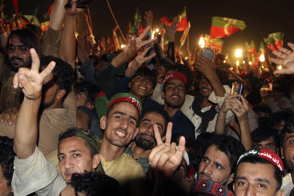 Supporters of Pakistani opposition leader Imran Khan's Tehreek-e-Insaf party attend a rally, in Peshawar, Pakistan, Tuesday, Sept. 6, 2022. Since he was toppled by parliament five months ago, former Prime Minister Imran Khan has demonstrated his popularity with rallies that have drawn huge crowds and signaled to his rivals that he remains a considerable political force. (AP Photo/Mohammad Sajjad)