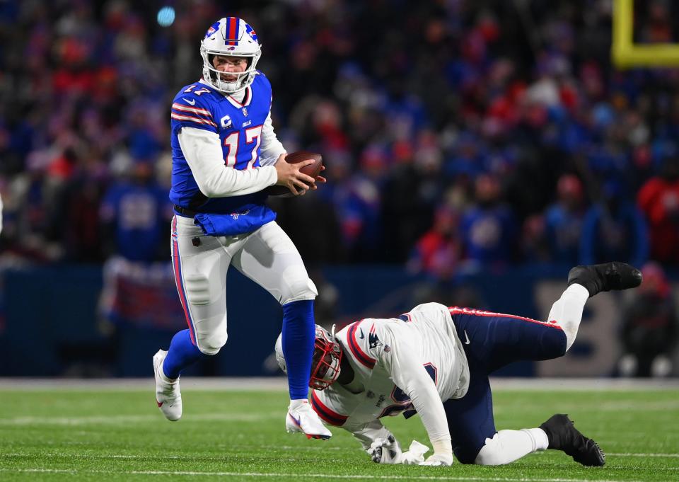 Buffalo Bills quarterback Josh Allen scrambles during the second quarter of the AFC Wild Card playoff game against the New England Patriots at Highmark Stadium in Orchard Park, New York, on Saturday, Jan 15, 2022.