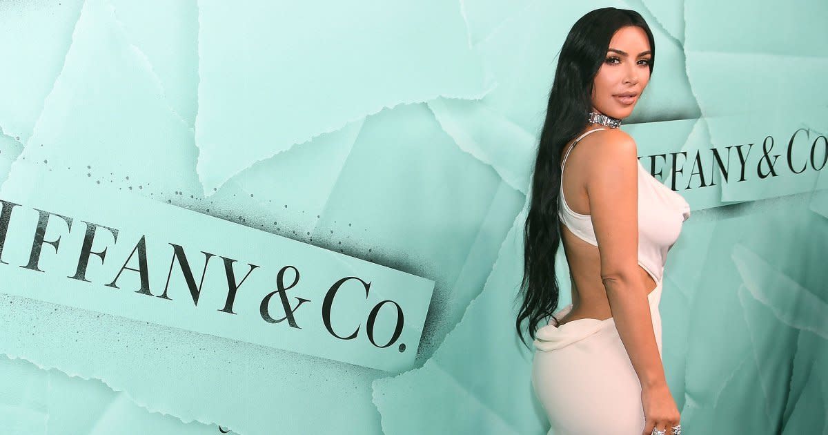 Kim Kardashian has two actual ass-istants to rub sand on her bum for her.  THIS IS NOT A DRILL, Celebrity