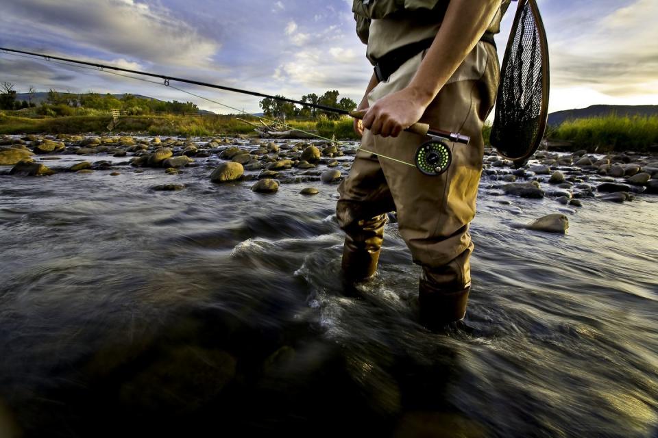 man fly fishing