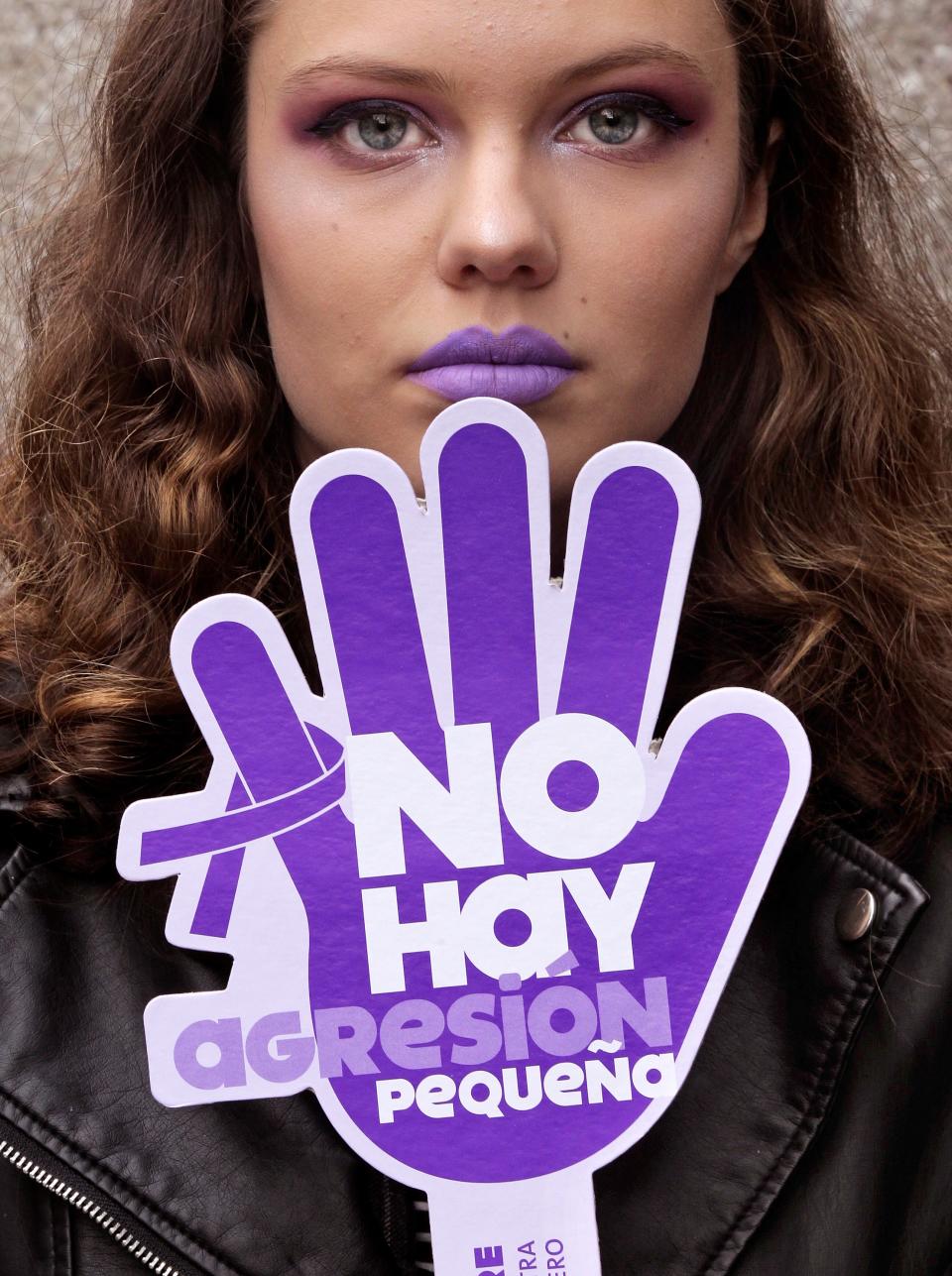 <p>A woman holds a banner that reads “There is no little aggression” during a gathering held in Gijon, northern Spain, on occasion of the International Day for the Elimination of Violence Against Women, Nov. 25, 2017. (Photo: Alberto Morante/EPA-EFE/REX/Shutterstock) </p>