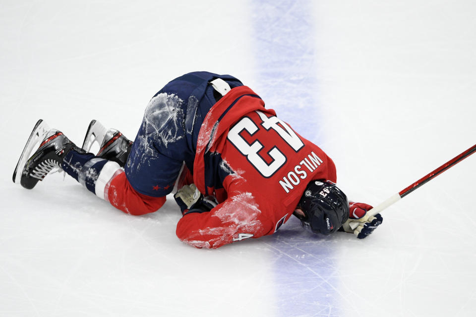 Washington Capitals right wing Tom Wilson lies on the ice after he was injured during the first period of the team's NHL hockey game against the Philadelphia Flyers, Saturday, May 8, 2021, in Washington. (AP Photo/Nick Wass)