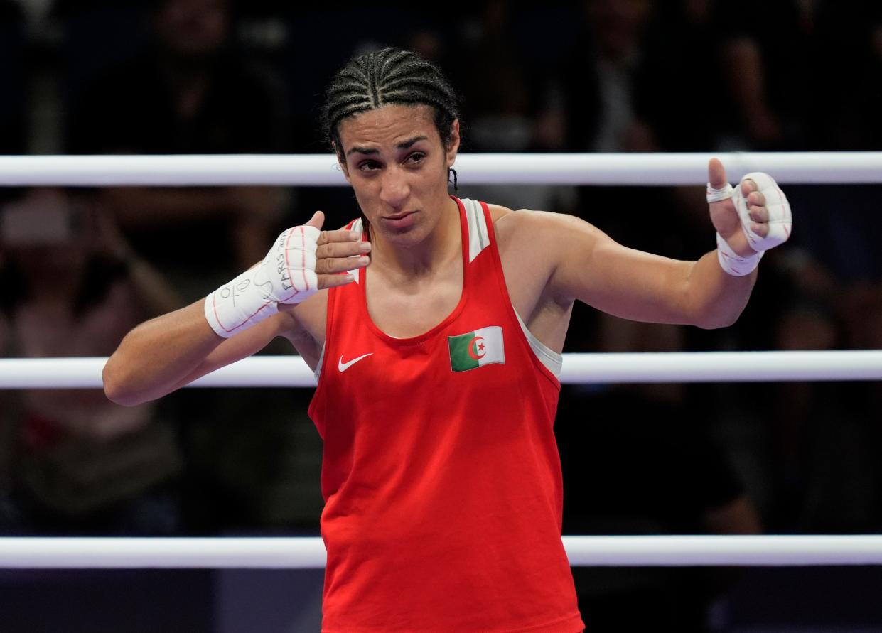 Aug 3, 2024; Paris, France; Imane Khelif (ALG) reacts after defeating Anna Luca Hamori (HUN) in a women's 66kg boxing quarterfinal during the Paris 2024 Olympic Summer Games at North Paris Arena. Mandatory Credit: Katie Goodale-USA TODAY Sports