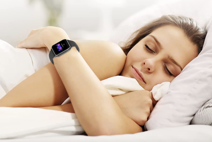 woman sleeping in bed wearing UMIDIGI Uwatch 5 Smartwatch (Photo via Amazon)