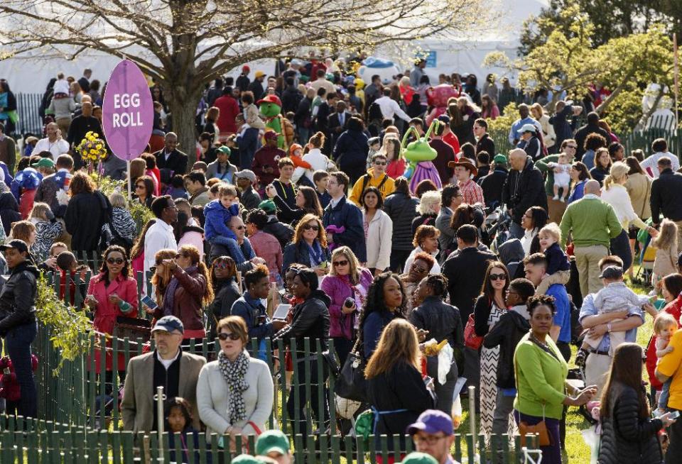 Throngs of children and parents gather on the South Lawn of the White House in Washington, Monday, April 21, 2014, for the annual White House Easter Egg Roll. Thousands of children are gathering at the White House for the annual Easter Egg Roll. President Barack Obama and first lady Michelle Obama will kick off the festivities on the White House South Lawn. This year's event features live music, cooking stations, storytelling, and of course, some Easter egg rolling. (AP Photo/J. Scott Applewhite)